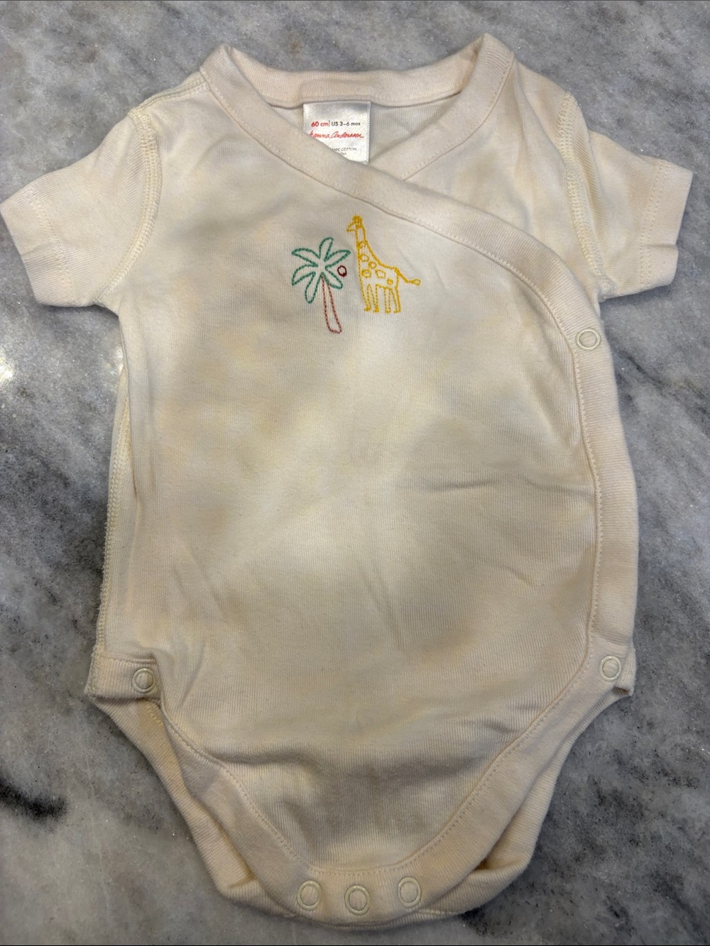 Hanna Andersson Cream Baby One-Piece with Yellow Giraffe and Green Palm